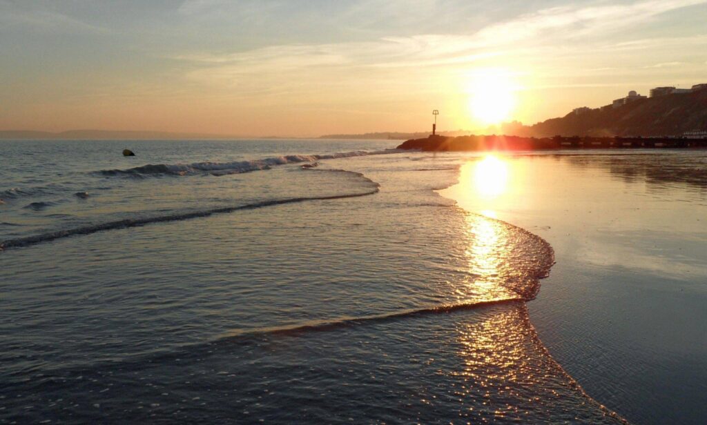 Rethink Your Perspective Boscombe Beach At Sunset With Small Waves On The Beach